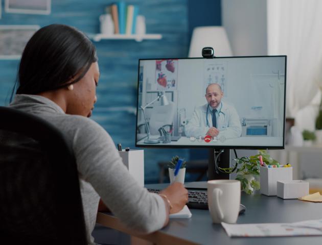 African american woman writing respiratory sickness treatment on notebook discussing pills treatment African american woman writing respiratory sickness treatment on notebook discussing pills treatment during online healthcare videocall meeting conference. Therapist doctor working remote from home